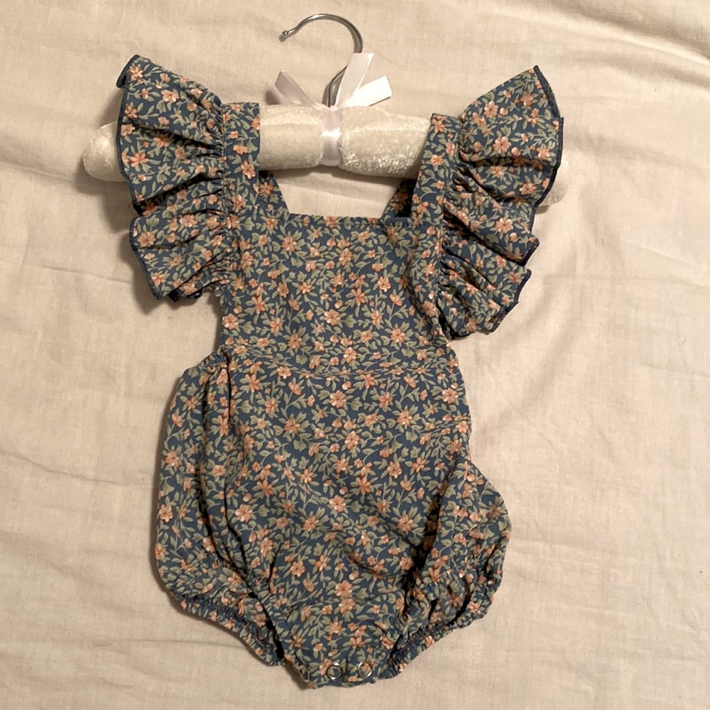 Bailey’s Blossoms bubble romper with flutter sleeves